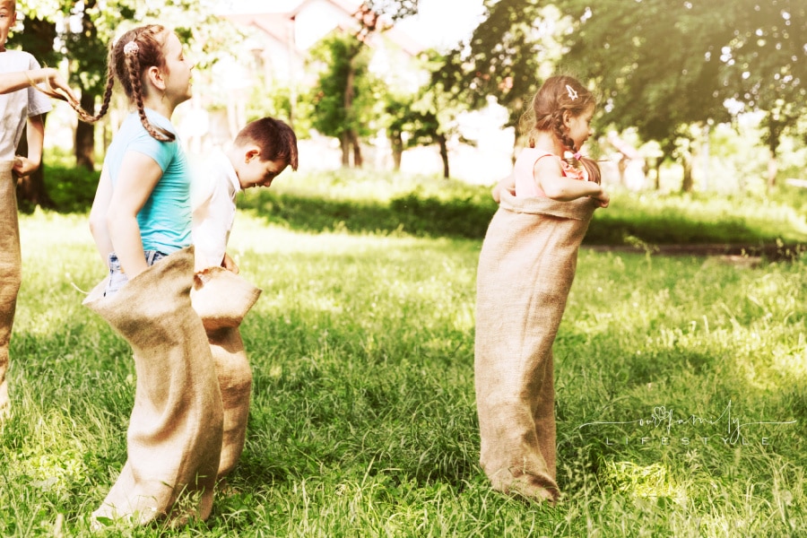 children-running-burlap-bags-sack-race