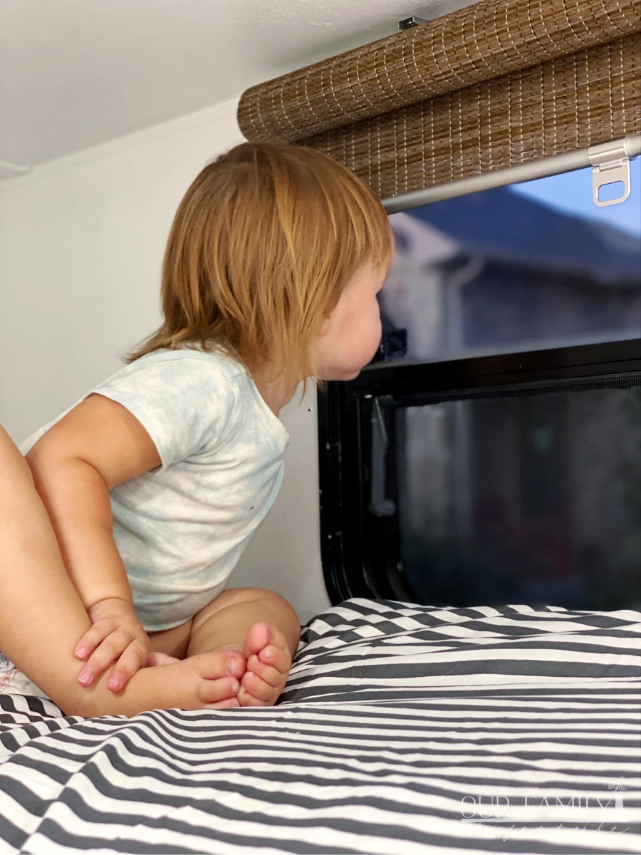 toddler looking out rv window