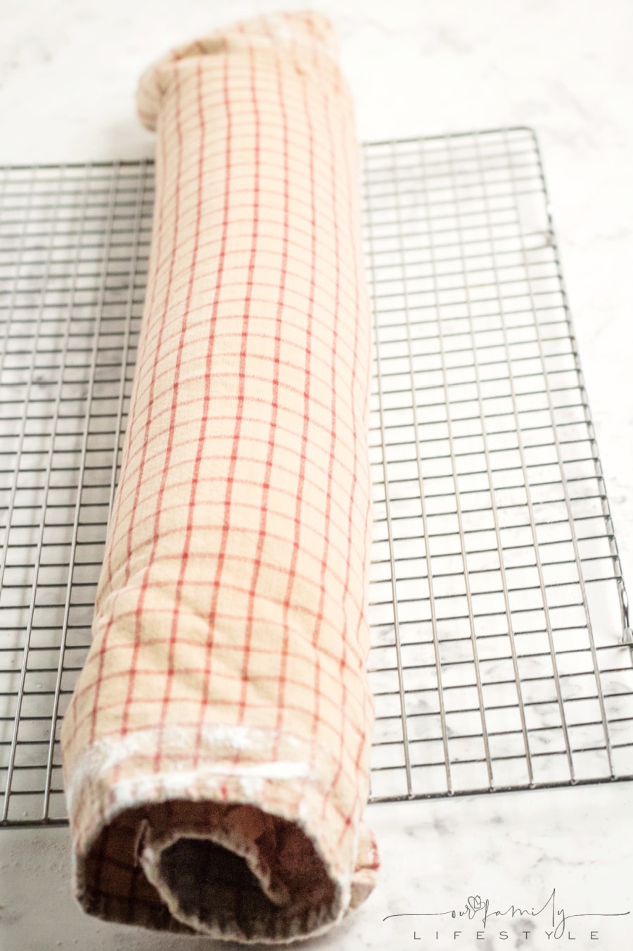 cake roll in a dishtowel to cool