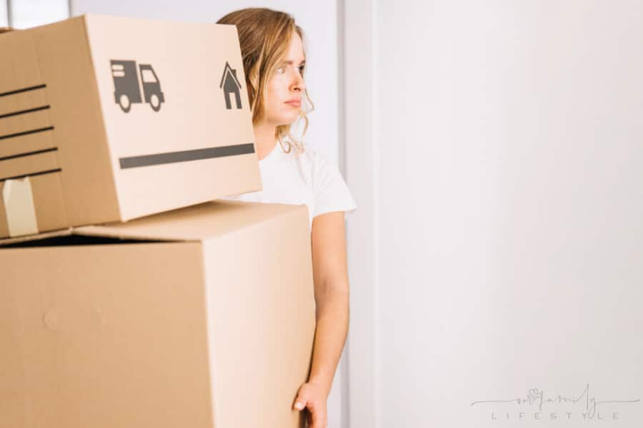 sad woman with moving boxes