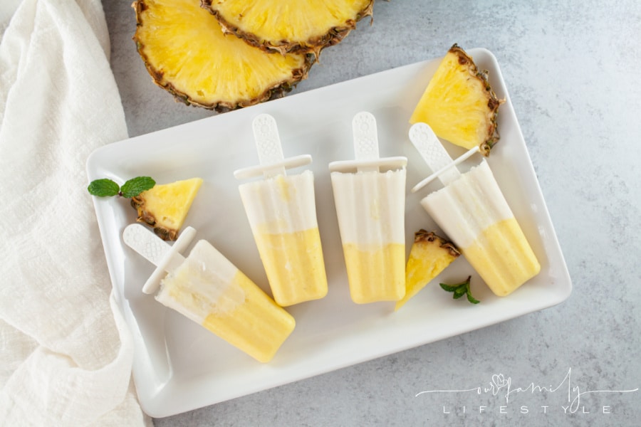 Pina Colada ice pops on a white tray