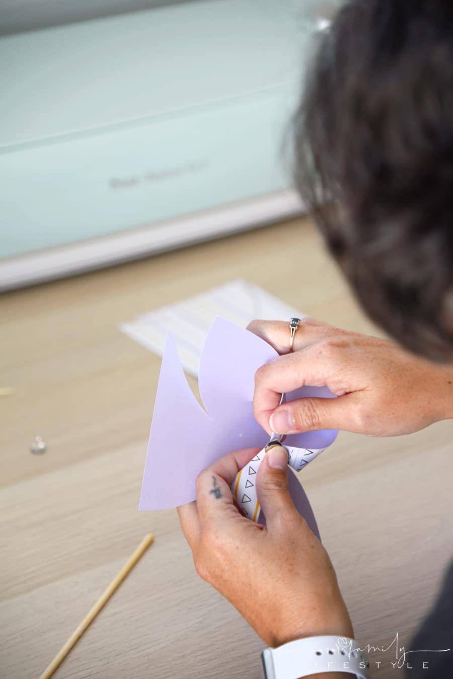 putting together a paper pinwheel