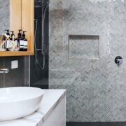 mosaic herringbone tiled shower feature wall