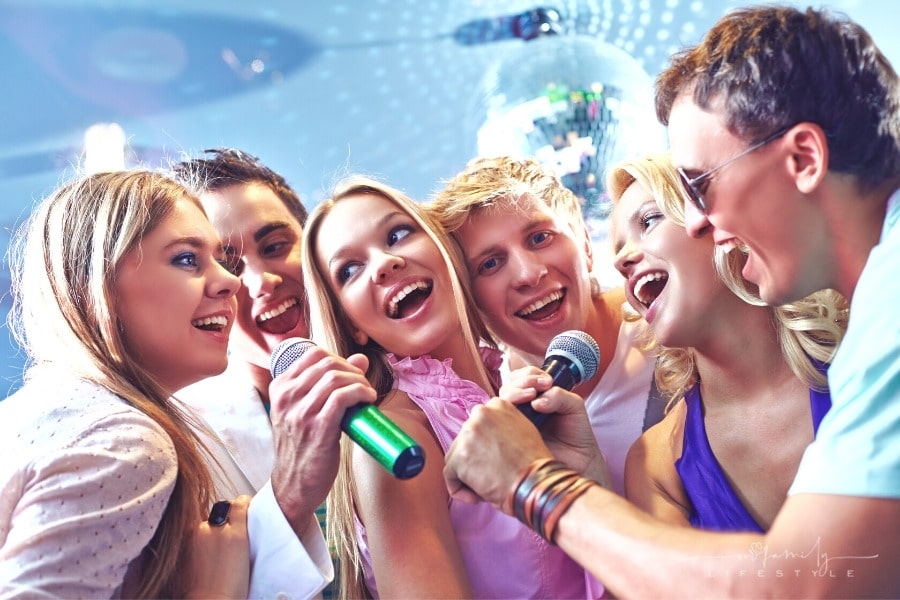 friends singing karaoke at a party