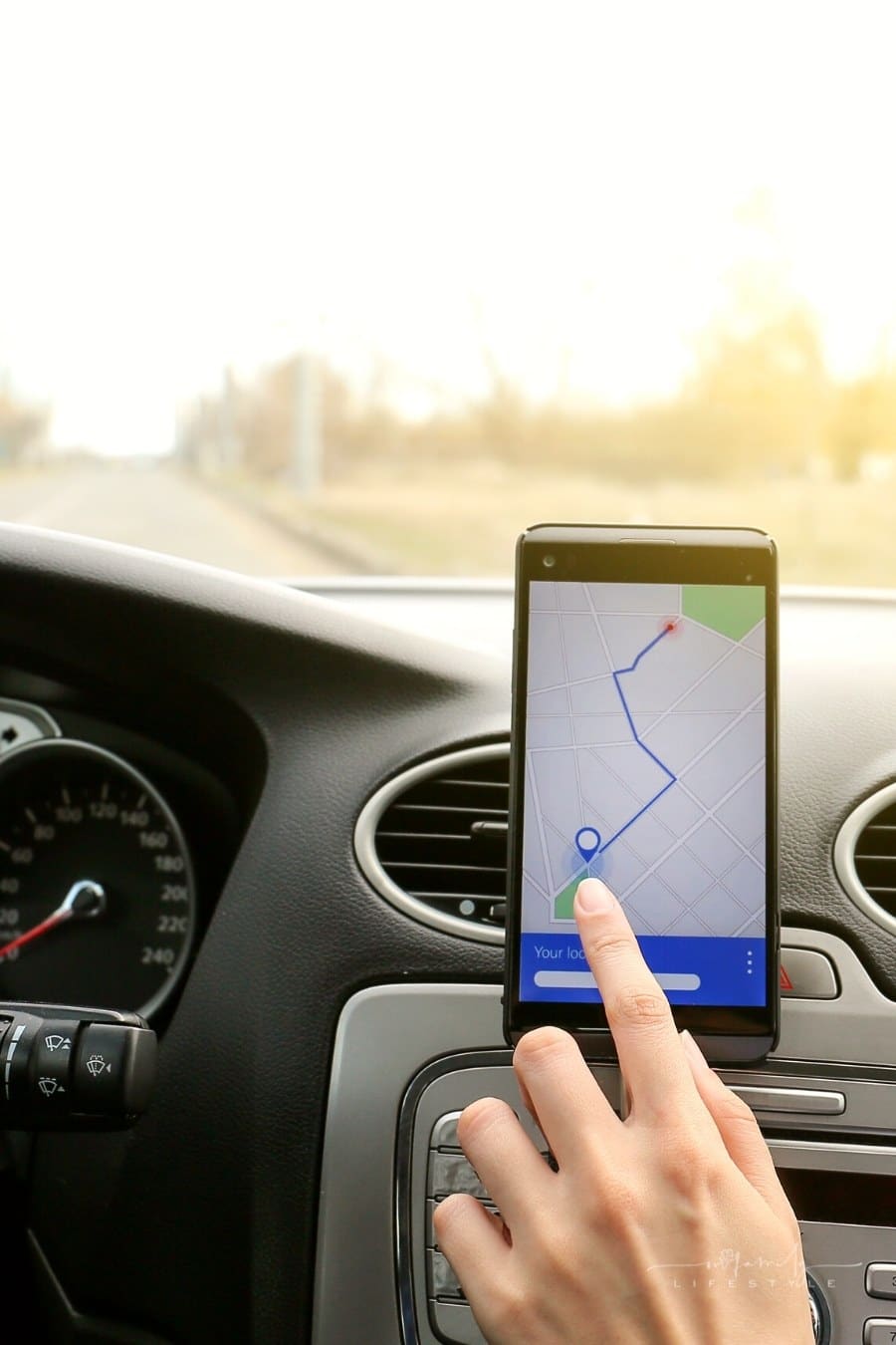 driver using smartphone for navigation