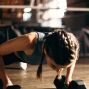 woman doing weight training with dumbbells