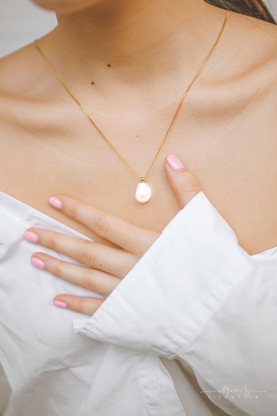 woman wearing a pearl necklace