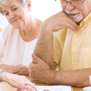 elderly couple reading life insurance contract