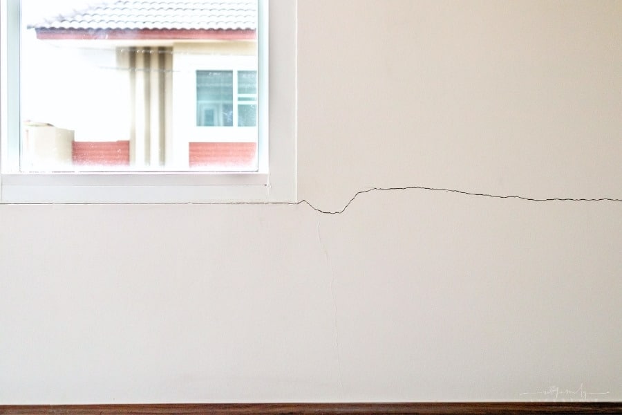 cracks in wall of house showing foundation damage