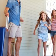 family entering vacation rental house