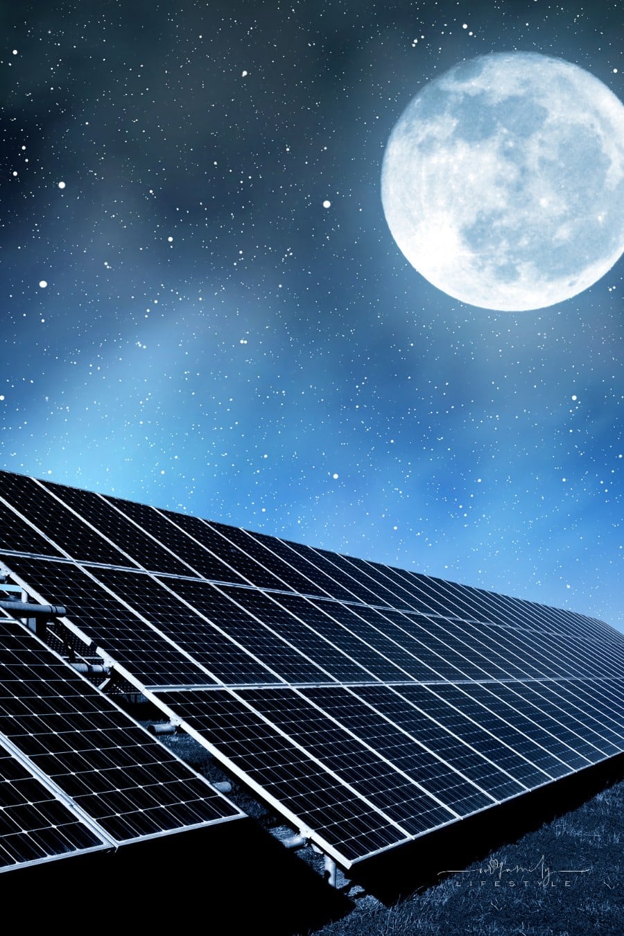 solar panels under a full moon in the night sky