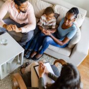 Family in a parenting coach therapy session
