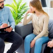 family with teen daughters in therapy session