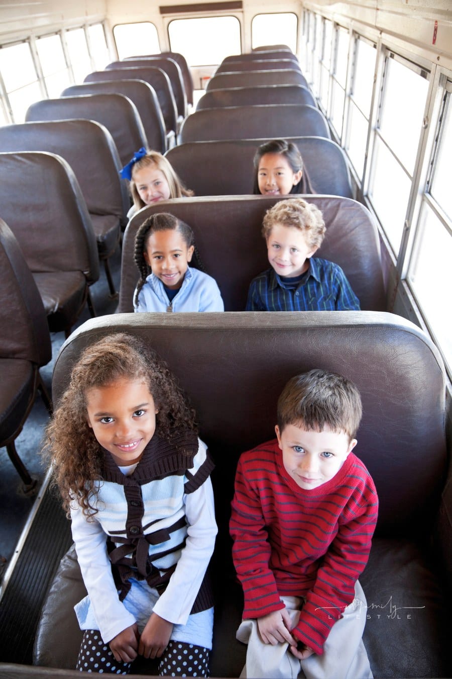 Children sitting inside school bus