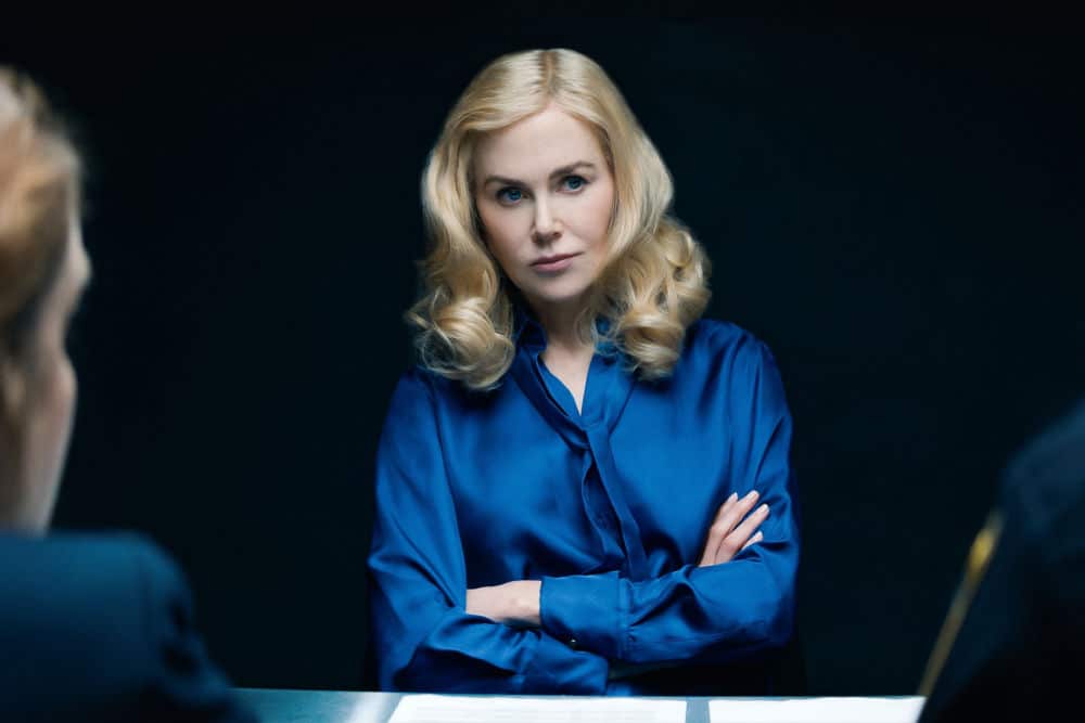 The image depicts Nicole Kidman portraying Greer Garrison Winbury in Netflix's The Perfect Couple. Her poised demeanor and striking presence in the scene hint at her character's depth and influence in the storyline, adding to the allure of this must-watch series.