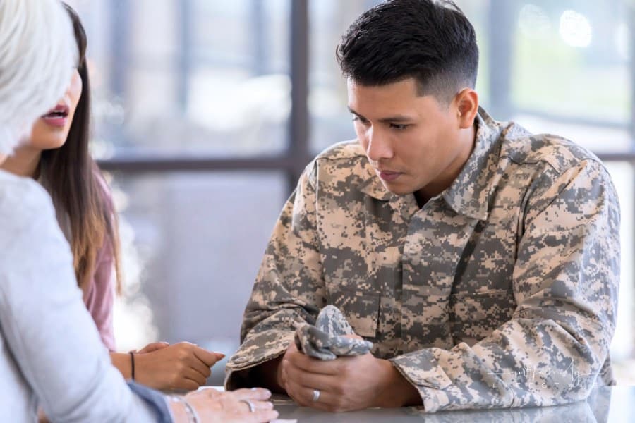 Young male soldier meets with mental health professional