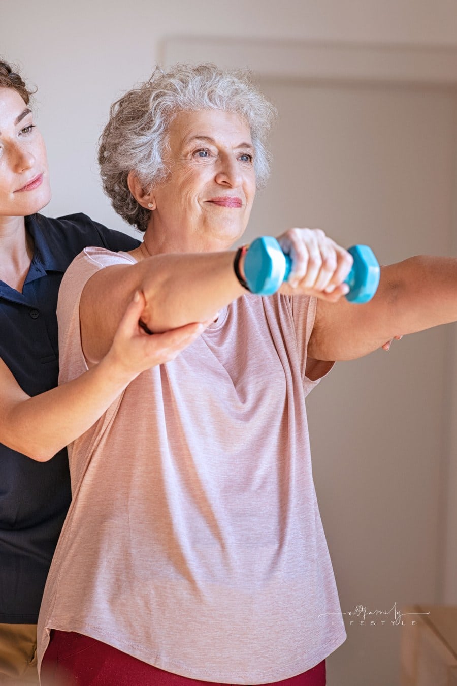 Senior Woman Using Dumbbells with Physiotherapist