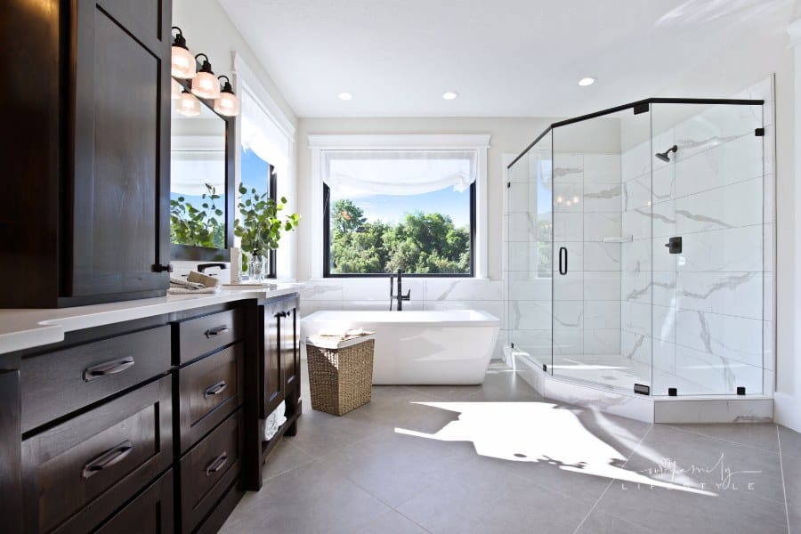 Modern luxury in master bathroom with large glass shower