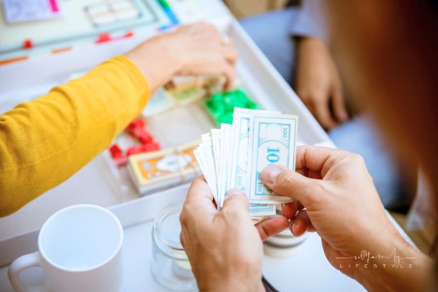 Hands playing board game