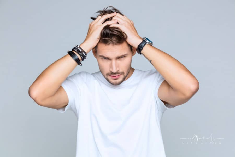 Stylish male model posing in white t-shirt